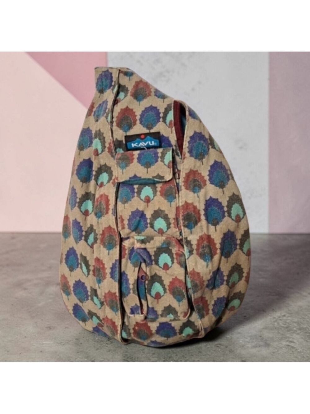 Kavu Multicolor Patterned Sling Backpack with Teal, Blue, Burgundy Accents